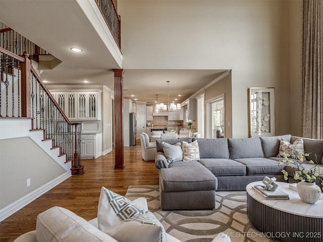 34159 E 698th Rd, Wagoner, OK 74467 - living room with a high ceiling, ornate columns, ornamental molding, recessed lighting, and stairs