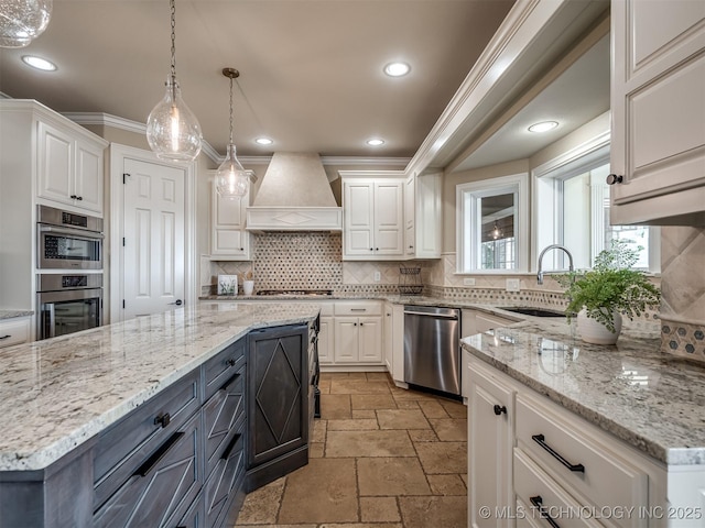 34159 E 698th Rd, Wagoner, OK 74467 - kitchen with appliances with stainless steel finishes, custom exhaust hood, white cabinetry, stone tile flooring, and recessed lighting