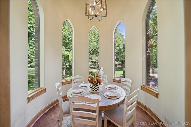 19735 E Woodhaven Rd, Owasso, OK 74055 - dining room with a chandelier and dark wood-style flooring