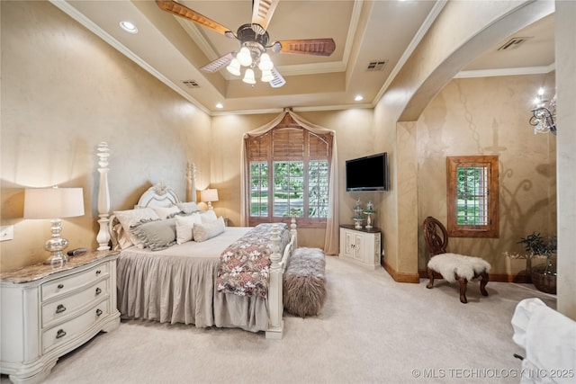 19735 E Woodhaven Rd, Owasso, OK 74055 - bedroom featuring light colored carpet, arched walkways, ornamental molding, ceiling fan, and a raised ceiling