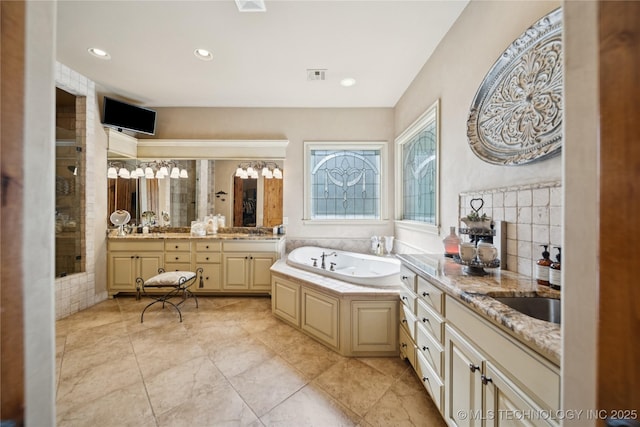 19735 E Woodhaven Rd, Owasso, OK 74055 - full bath with a bath, vanity, a tile shower, and recessed lighting
