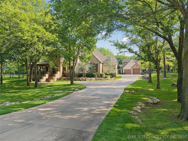 19735 E Woodhaven Rd, Owasso, OK 74055 - view of front of house featuring a front yard and a garage