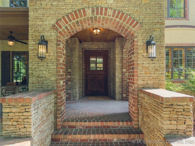 19735 E Woodhaven Rd, Owasso, OK 74055 - doorway to property featuring brick siding and a porch