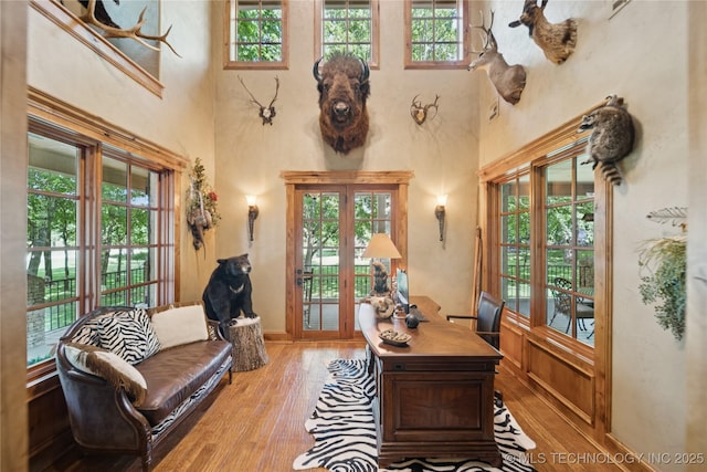 19735 E Woodhaven Rd, Owasso, OK 74055 - office with a towering ceiling, light wood-style floors, and french doors