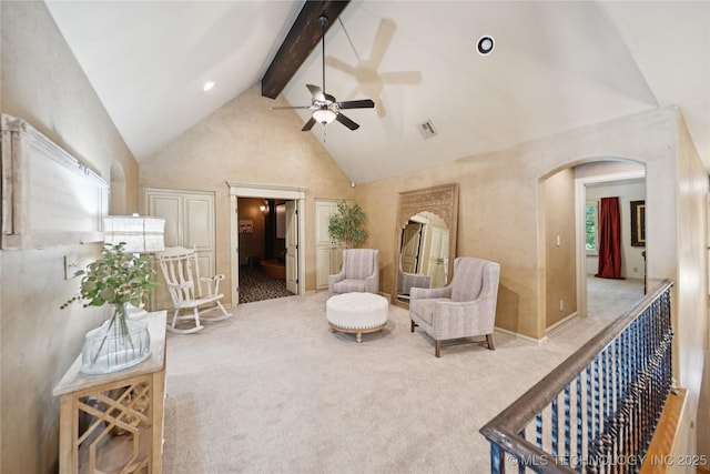 19735 E Woodhaven Rd, Owasso, OK 74055 - sitting room featuring a ceiling fan, carpet flooring, beam ceiling, high vaulted ceiling, and arched walkways