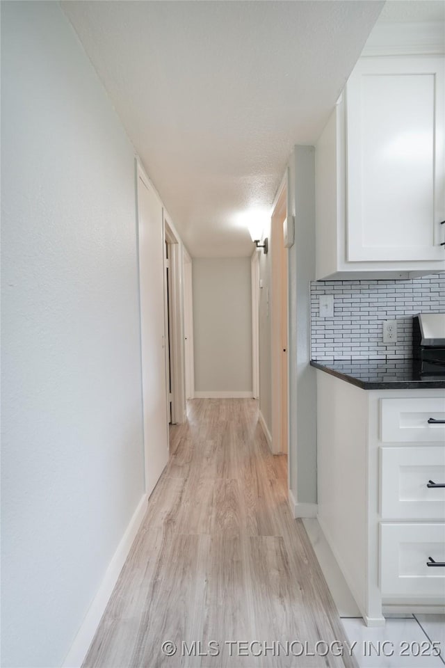 6240 E Latimer Pl, Tulsa, OK 74115 - hall featuring light wood-type flooring and baseboards