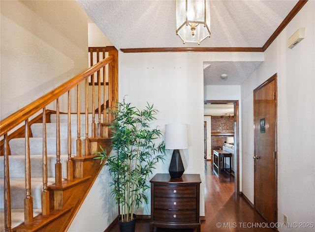 7222 E 87th St, Tulsa, OK 74133 - stairs with a textured ceiling, wood finished floors, a chandelier, and ornamental molding