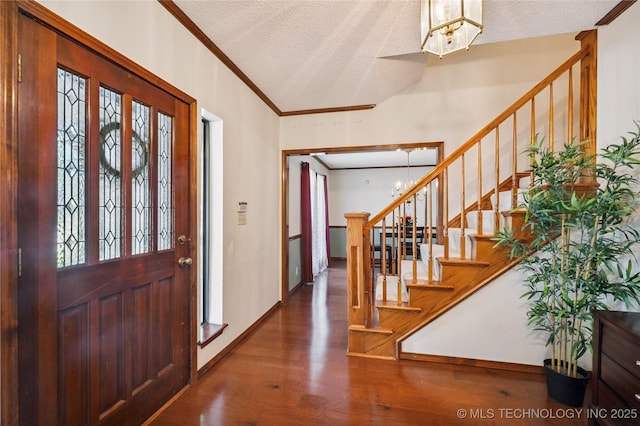7222 E 87th St, Tulsa, OK 74133 - foyer entrance featuring wood finished floors, crown molding, stairs, a textured ceiling, and a chandelier