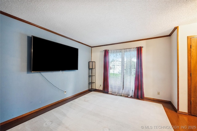 7222 E 87th St, Tulsa, OK 74133 - unfurnished room with ornamental molding, a textured ceiling, and wood finished floors