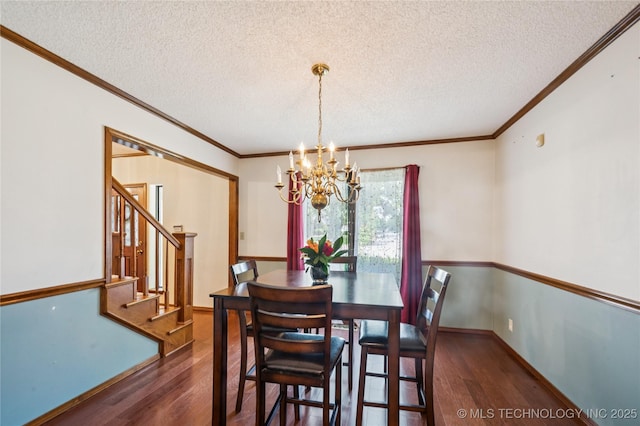 7222 E 87th St, Tulsa, OK 74133 - dining area featuring wood finished floors, a chandelier, a textured ceiling, stairway, and crown molding