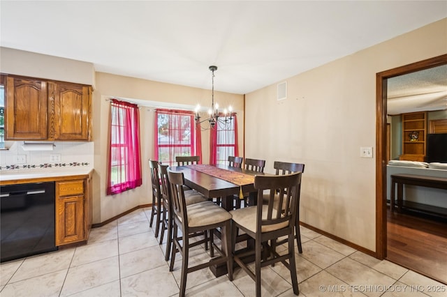 7222 E 87th St, Tulsa, OK 74133 - dining room featuring a chandelier and light tile patterned floors