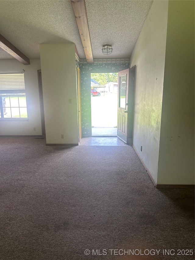 282 Westland Rd, Sapulpa, OK 74066 - hall featuring a textured ceiling, carpet floors, plenty of natural light, and beam ceiling