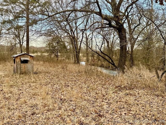 105148 S 4500, Vian, OK 74962 - view of yard featuring a storage unit