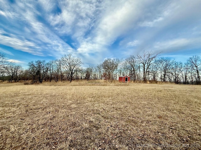 105148 S 4500, Vian, OK 74962 - view of grassy yard with a storage shed and a view of countryside