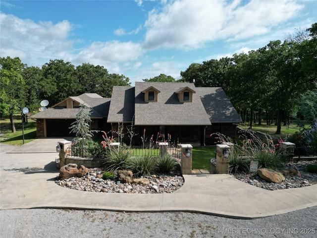 6166 Hedges St, Ardmore, OK 73401 - view of front of house with driveway, an attached garage, roof with shingles, and a fenced front yard
