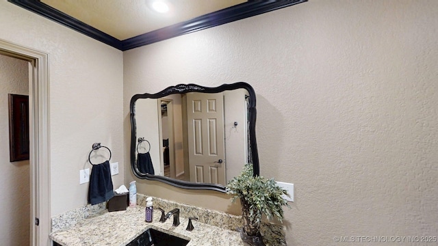 6166 Hedges St, Ardmore, OK 73401 - bathroom featuring ornamental molding and vanity