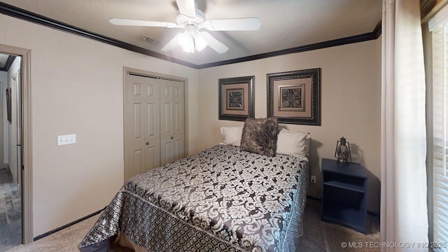 6166 Hedges St, Ardmore, OK 73401 - carpeted bedroom with crown molding, a closet, and a ceiling fan