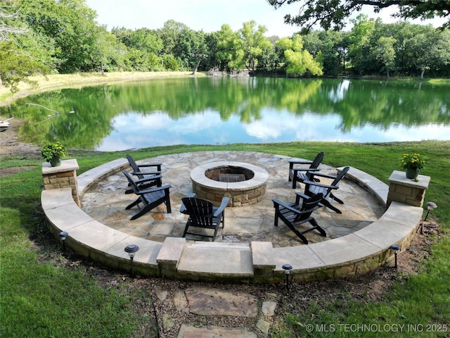 6166 Hedges St, Ardmore, OK 73401 - view of patio with a fire pit and a water view