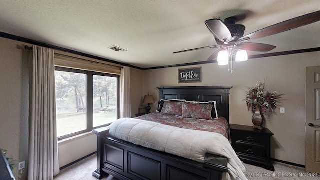 6166 Hedges St, Ardmore, OK 73401 - bedroom with light colored carpet, crown molding, and a ceiling fan