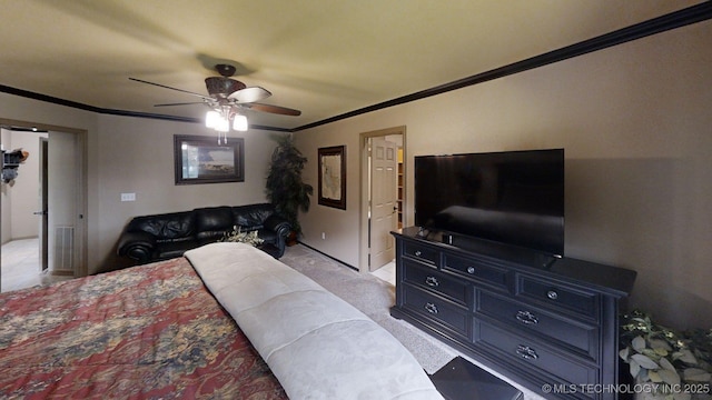 6166 Hedges St, Ardmore, OK 73401 - bedroom with ornamental molding, light colored carpet, and a ceiling fan