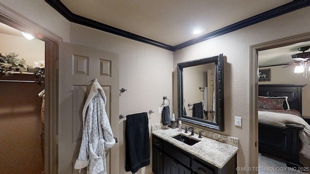 6166 Hedges St, Ardmore, OK 73401 - ensuite bathroom with crown molding, vanity, a ceiling fan, and a textured wall