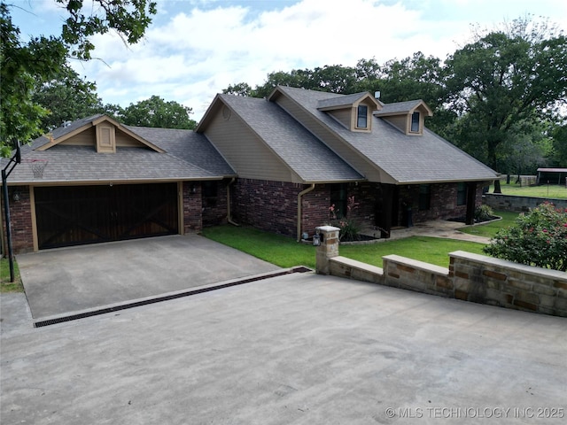 6166 Hedges St, Ardmore, OK 73401 - view of front facade featuring brick siding, a front lawn, a shingled roof, and a garage