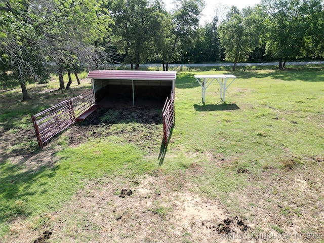 6166 Hedges St, Ardmore, OK 73401 - view of yard featuring an outbuilding and a carport
