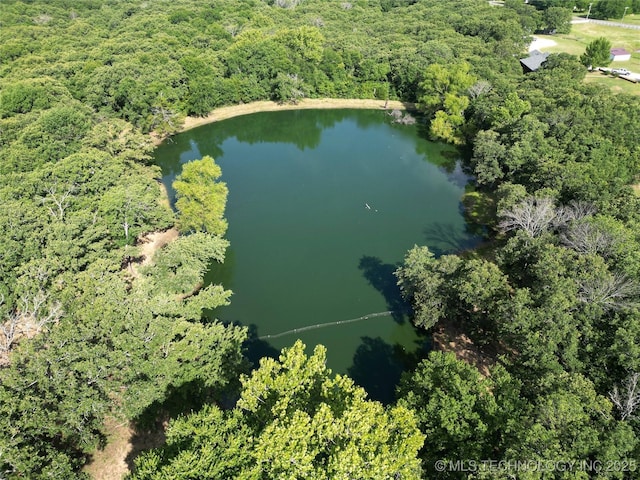 6166 Hedges St, Ardmore, OK 73401 - aerial overview of property's location featuring a nearby body of water and a heavily wooded area