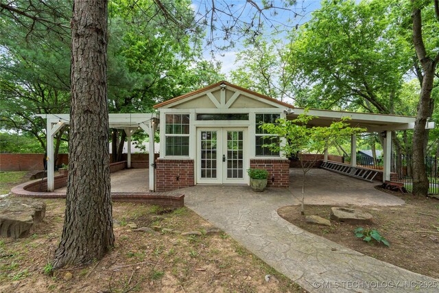 213 Moccasin Ln, Sapulpa, OK 74066 - view of outdoor structure featuring french doors