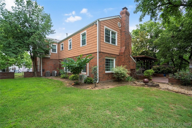 213 Moccasin Ln, Sapulpa, OK 74066 - view of side of home featuring a chimney and brick siding