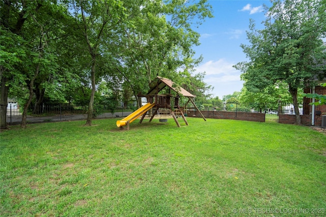213 Moccasin Ln, Sapulpa, OK 74066 - fenced backyard with a playground
