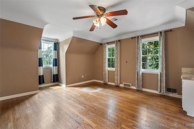 213 Moccasin Ln, Sapulpa, OK 74066 - additional living space featuring ceiling fan, wood finished floors, and vaulted ceiling