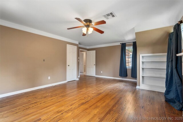 213 Moccasin Ln, Sapulpa, OK 74066 - unfurnished bedroom with wood finished floors, ceiling fan, and crown molding
