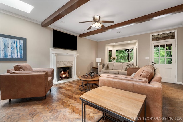 213 Moccasin Ln, Sapulpa, OK 74066 - living area with a fireplace, beamed ceiling, a ceiling fan, recessed lighting, and ornamental molding