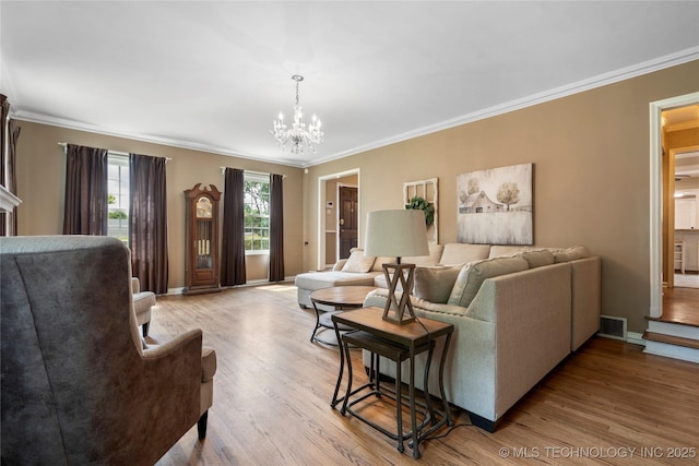 213 Moccasin Ln, Sapulpa, OK 74066 - living area with ornamental molding, a chandelier, and wood finished floors