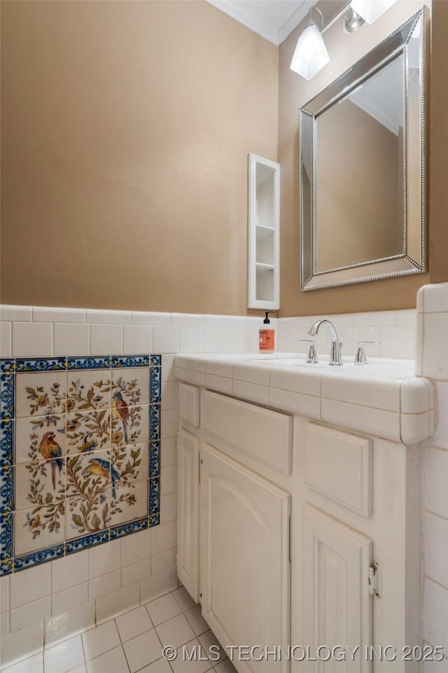 213 Moccasin Ln, Sapulpa, OK 74066 - bathroom featuring crown molding, vanity, tile patterned floors, and tile walls