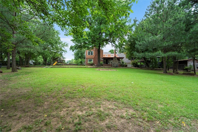 213 Moccasin Ln, Sapulpa, OK 74066 - view of green lawn with a playground