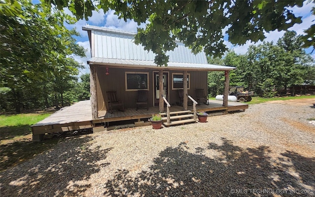 181103 W Sherman Rd, Moyers, OK 74557 - view of front of property featuring a metal roof and a wooden deck