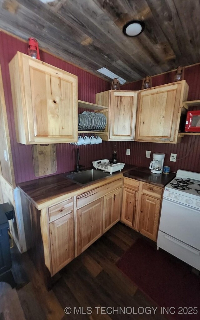181103 W Sherman Rd, Moyers, OK 74557 - kitchen with white range with gas cooktop, dark wood-style flooring, dark countertops, wooden ceiling, and wood walls