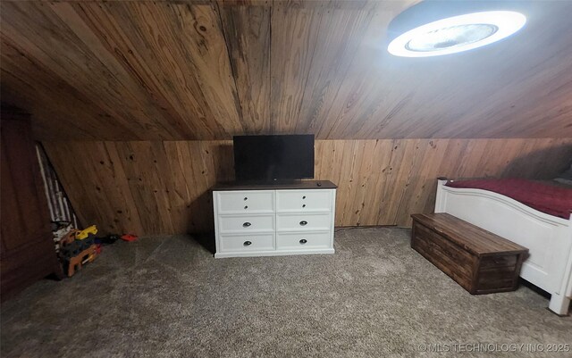 181103 W Sherman Rd, Moyers, OK 74557 - bedroom featuring wooden walls, carpet flooring, and wooden ceiling