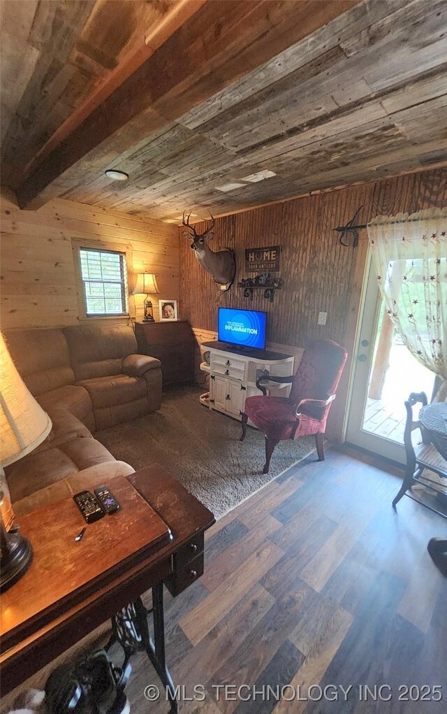 181103 W Sherman Rd, Moyers, OK 74557 - living room featuring wooden walls, wood finished floors, and wooden ceiling