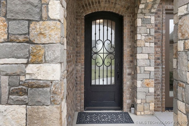 8337 N 149th E Ave, Owasso, OK 74055 - entrance to property featuring stone siding and brick siding