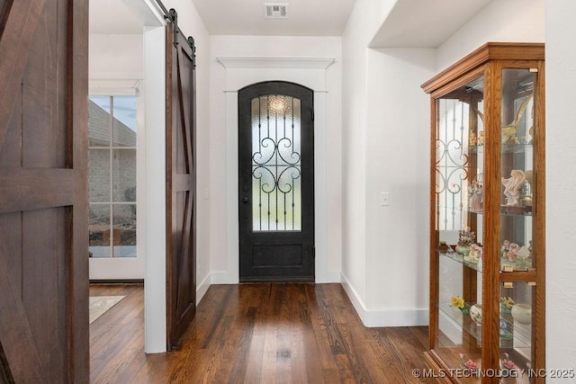 8337 N 149th E Ave, Owasso, OK 74055 - entrance foyer featuring dark wood finished floors and a barn door