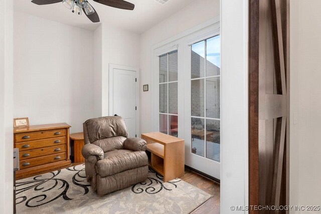 8337 N 149th E Ave, Owasso, OK 74055 - living area with wood finished floors and ceiling fan