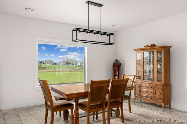 8337 N 149th E Ave, Owasso, OK 74055 - dining area with baseboards
