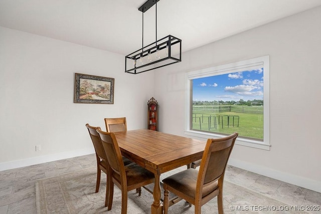 8337 N 149th E Ave, Owasso, OK 74055 - dining area featuring baseboards