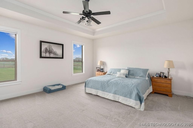 8337 N 149th E Ave, Owasso, OK 74055 - bedroom with carpet floors, a raised ceiling, ornamental molding, and ceiling fan