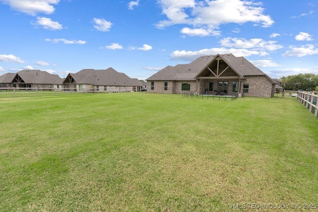 8337 N 149th E Ave, Owasso, OK 74055 - back of house featuring a fenced backyard and brick siding