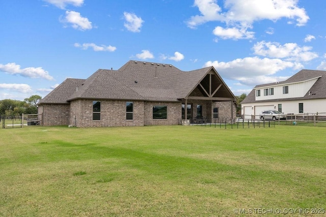 8337 N 149th E Ave, Owasso, OK 74055 - back of house featuring brick siding, roof with shingles, and a garage