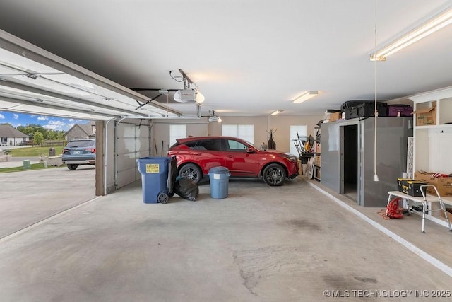 8337 N 149th E Ave, Owasso, OK 74055 - garage featuring a garage door opener